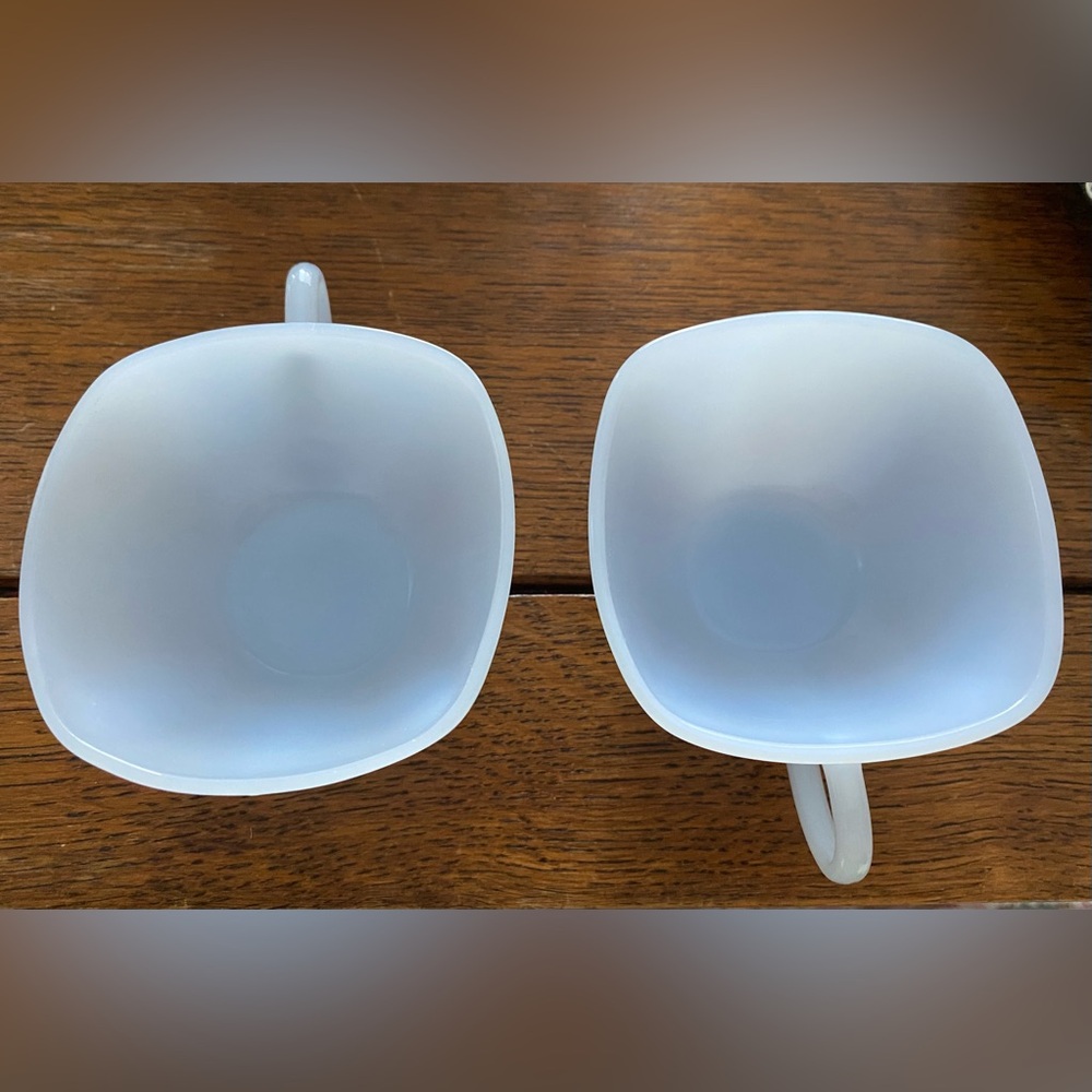 Two blue milk glass coffee-tea cups.  Beautiful and look unused.  No stain. EC